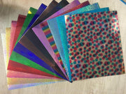 Bundle of 14 laser heat transfer vinyl sheets, each 12 x 12 inches, with prismatic rainbow finish