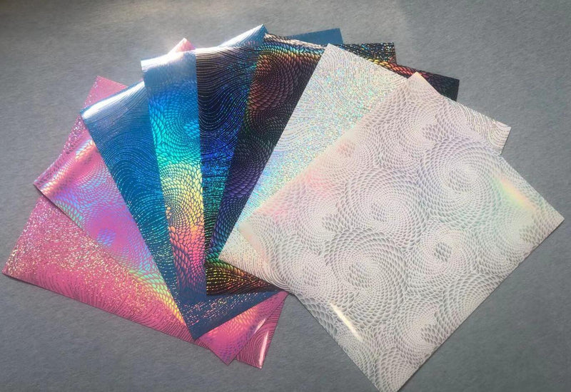 Bundle of 8 patterned heat transfer vinyl sheets, each 12 x 12 inches, with printed designs